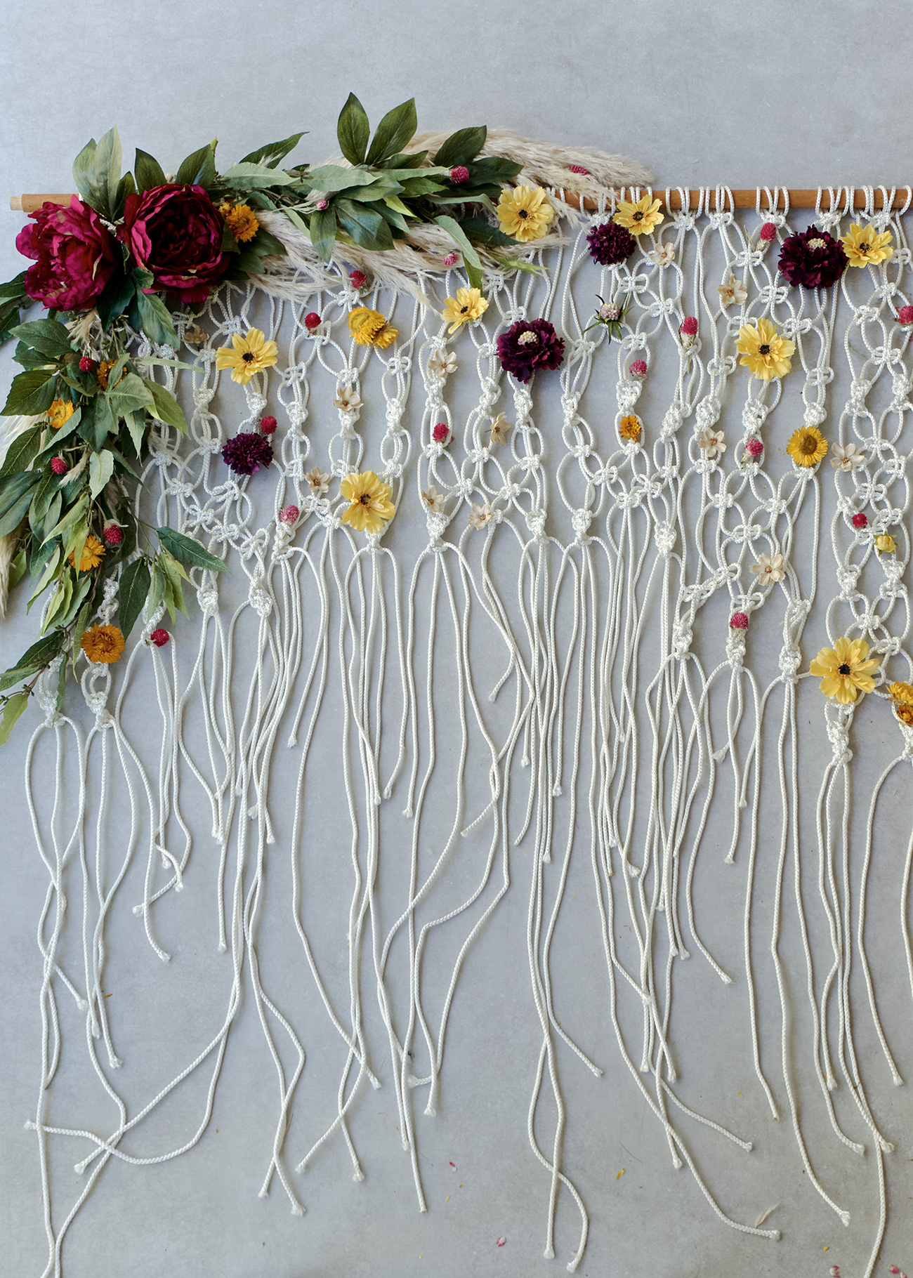 DIY Silk Floral Macramé Backdrop from Green Wedding Shoes | 8 Modern DIY Macrame Projects