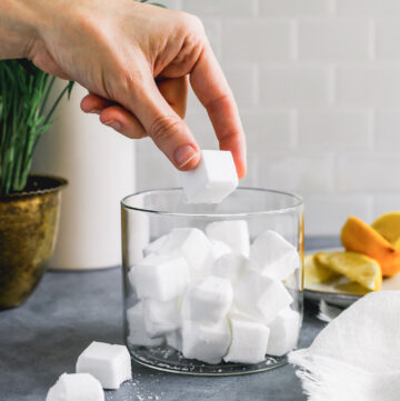 Hate doing dishes? We do too. Do them in record time with these DIY dishwasher pods made with non-toxic ingredients you probably already have!