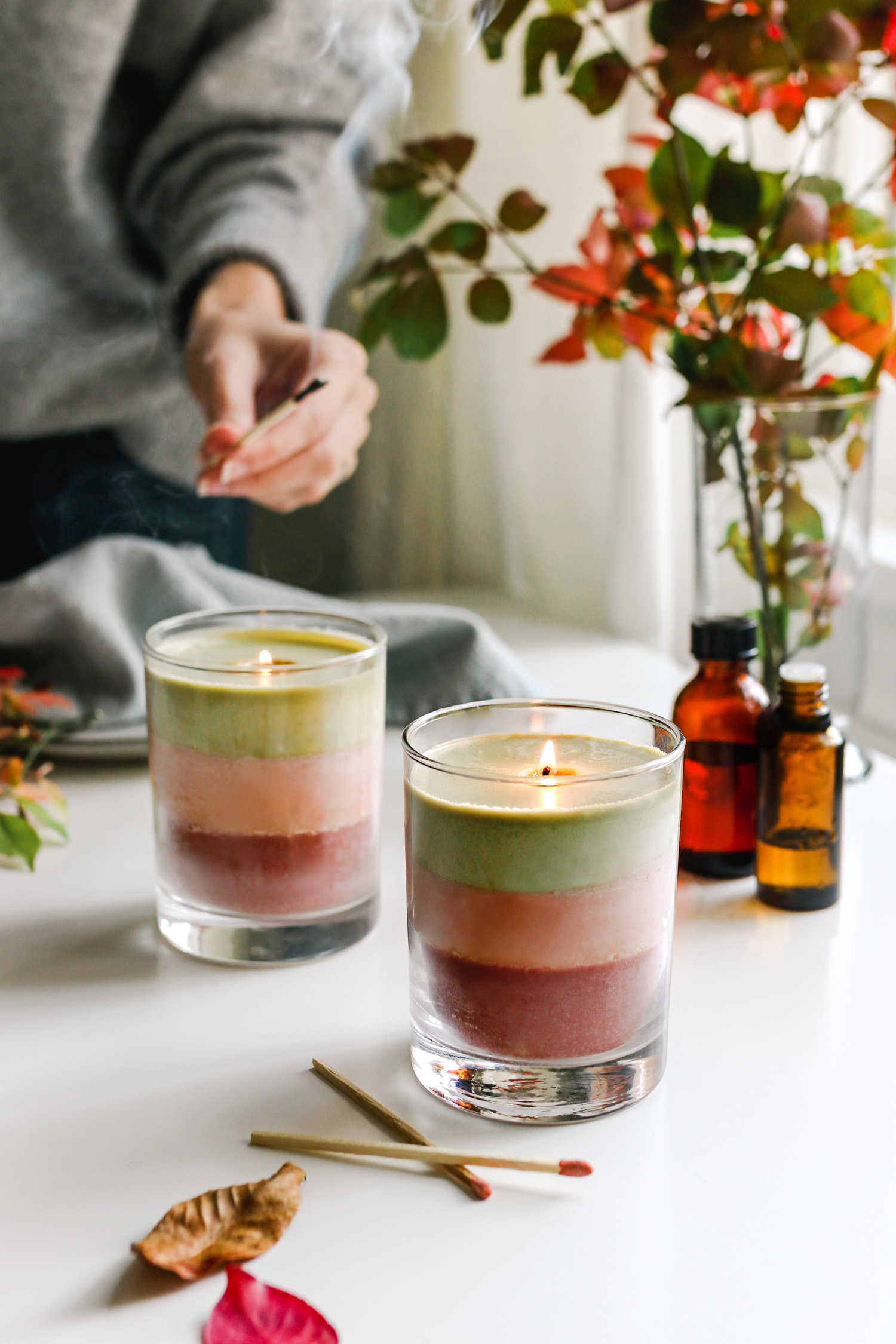 Just a few simple ingredients make up these cute, gift-worthy DIY holiday candles, layered with holiday colors and scents.