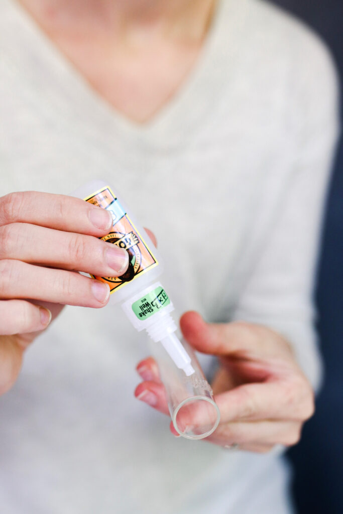 Adding glue to test tube vase