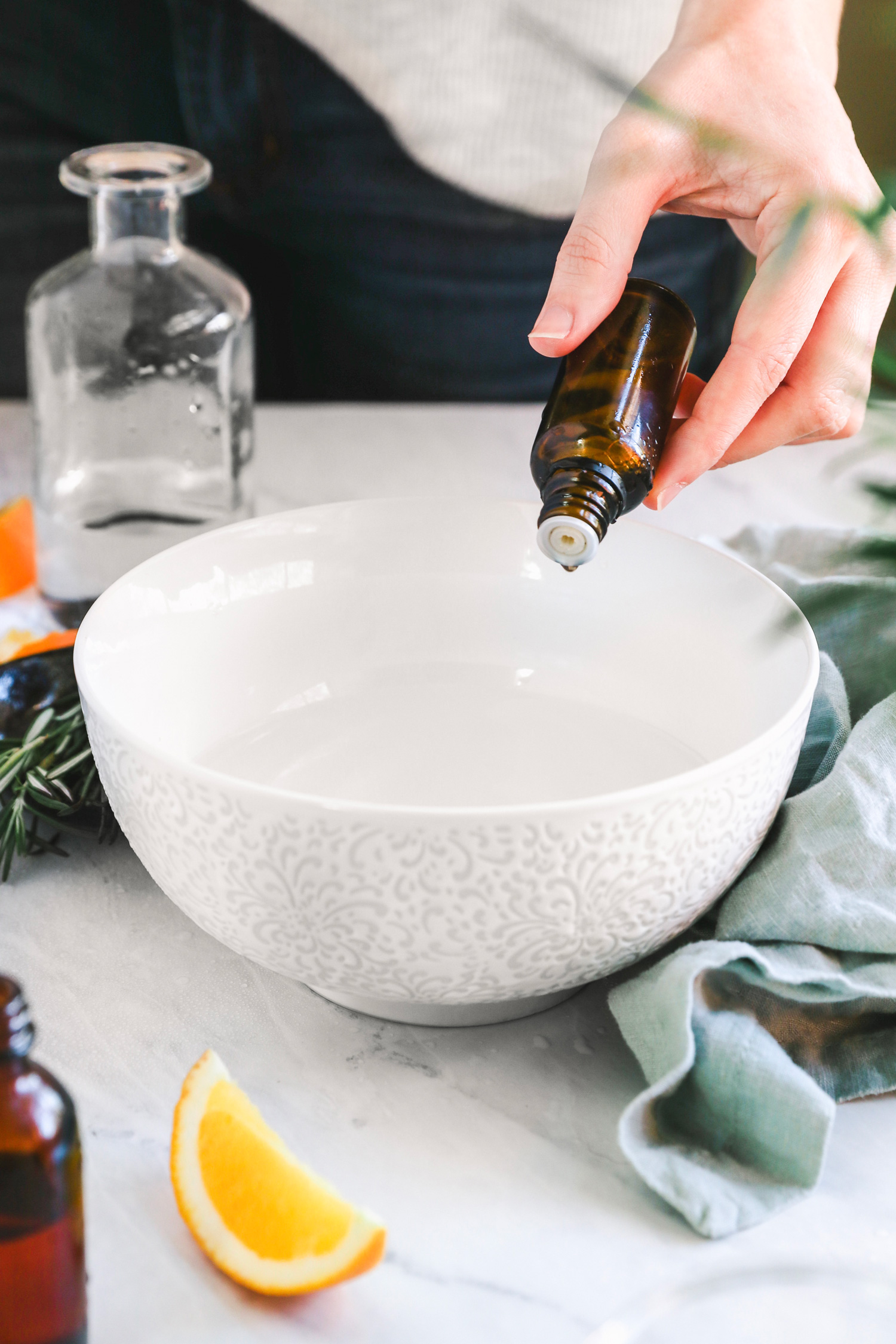 This DIY upholstery spray removes stubborn stains and refreshes furniture with the power of essential oil, vinegar, and rosemary.