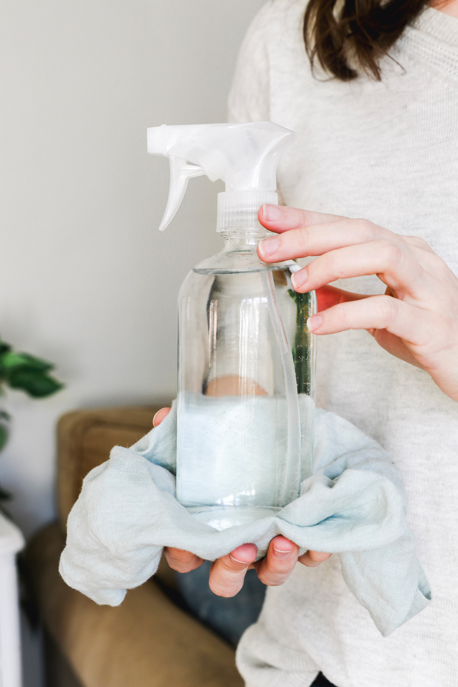 This DIY upholstery spray removes stubborn stains and refreshes furniture with the power of essential oil, vinegar, and rosemary.