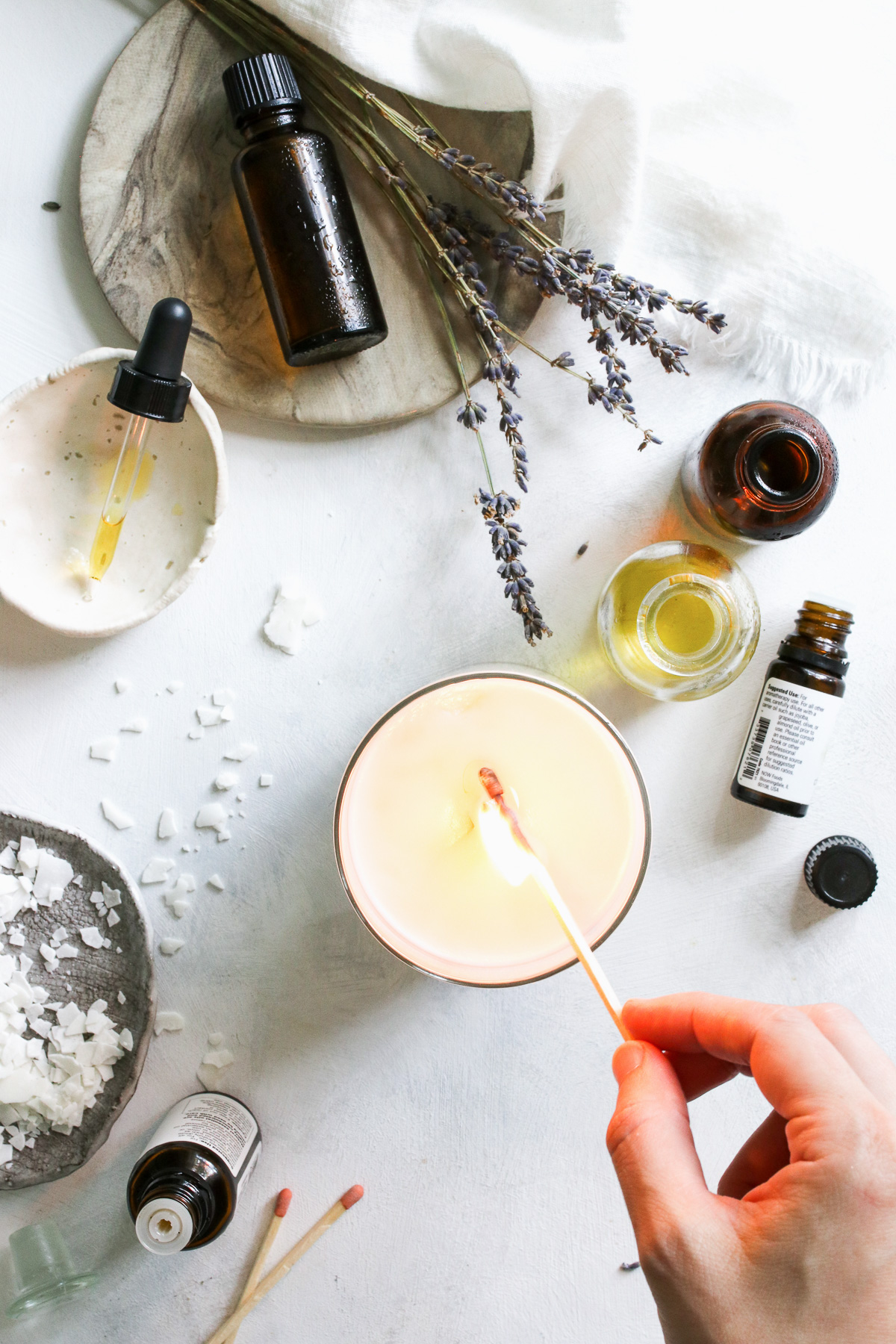 Here's everything you need to know to start making your own DIY essential oil candles. Learn which essential oils to use, how much to add and and when.