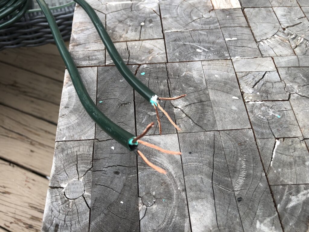 Exposing copper wire to repair an extension cord