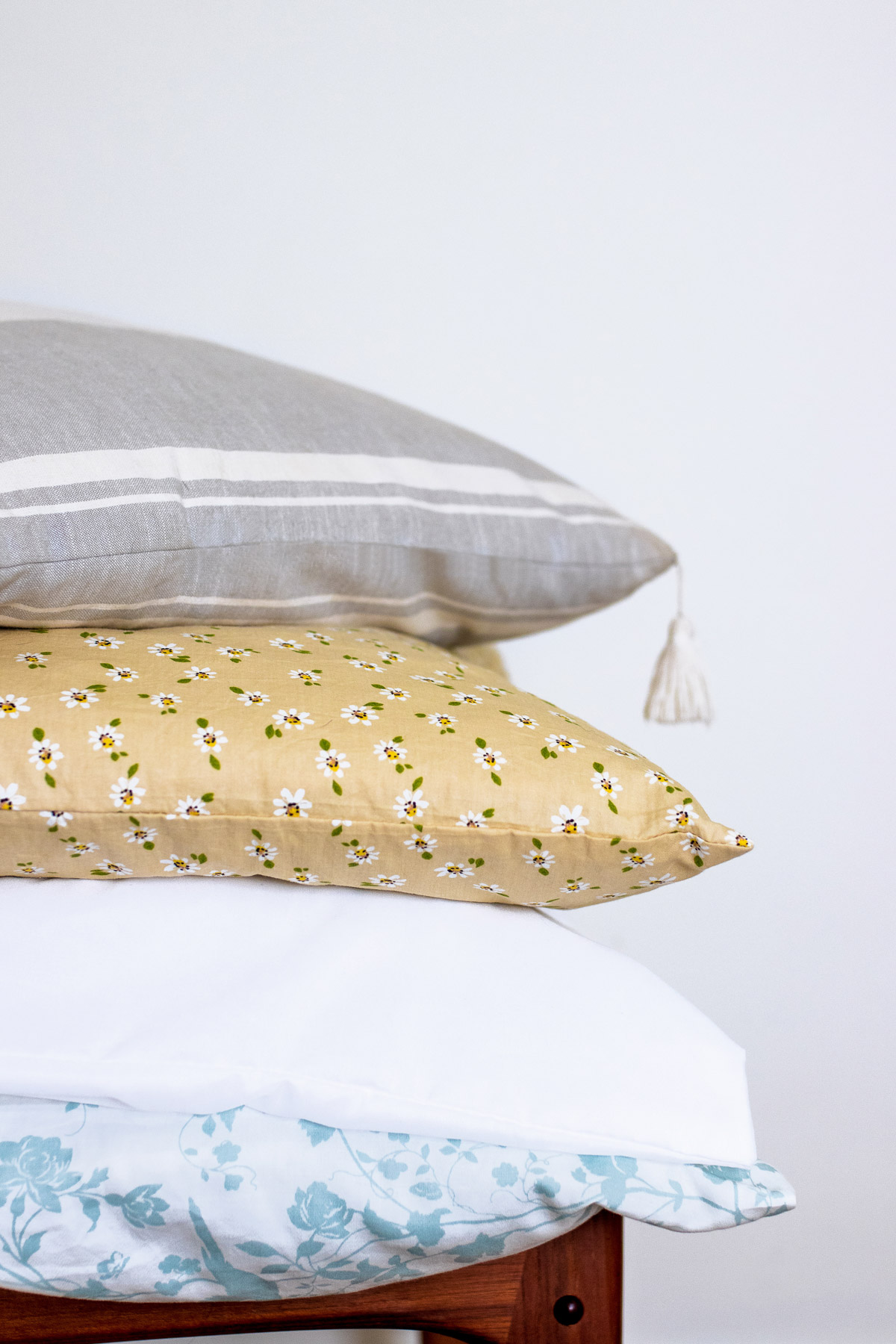 Learn how to wash your pillows & why they need it